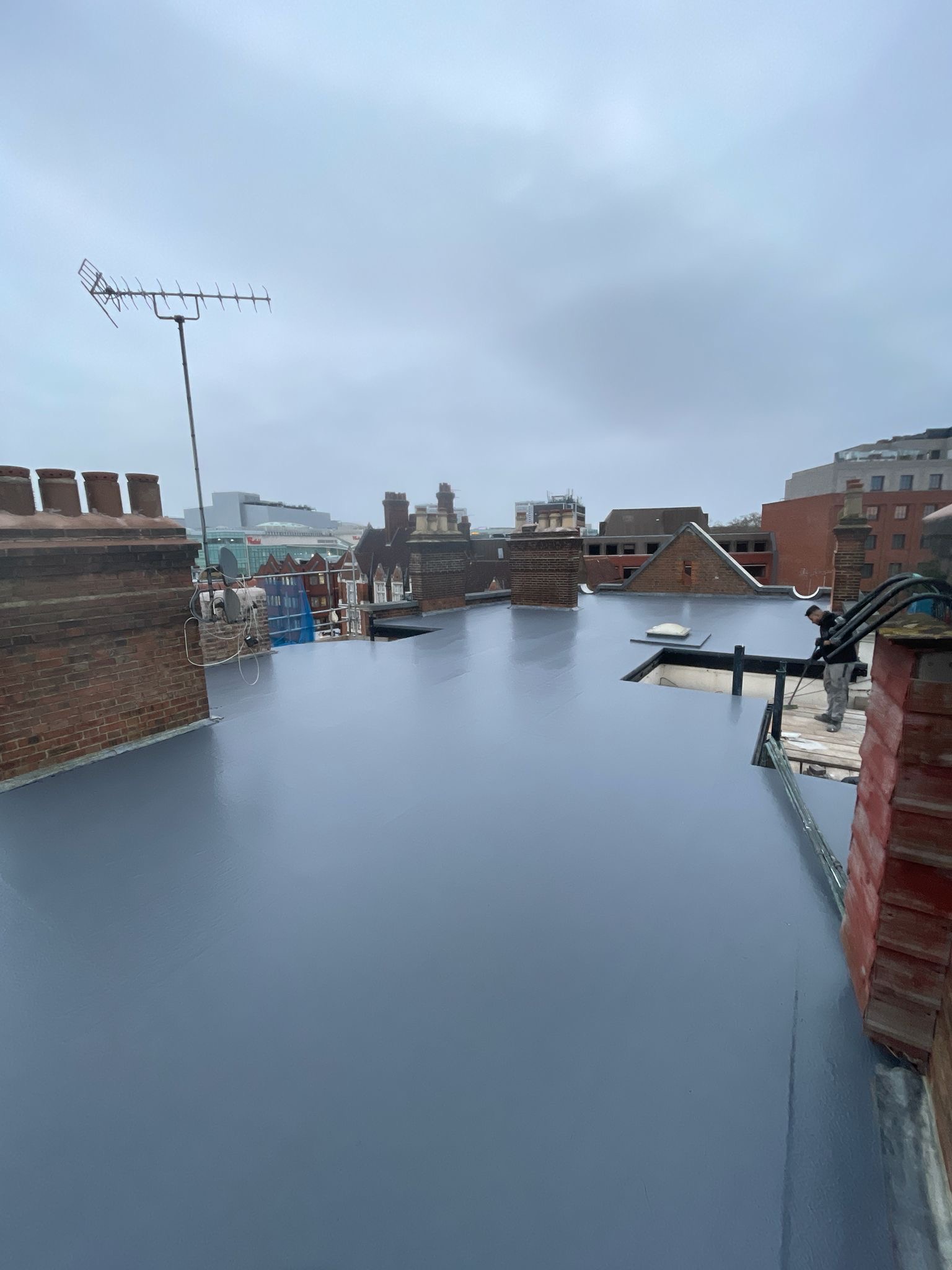 Foogle Roofing team at work on commercial flat roof